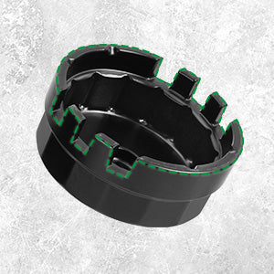 Black and green circular component on a light gray background